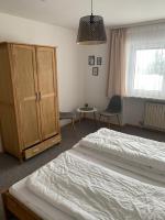 Postel nebo postele na pokoji v ubytování Ferienwohnung- Pfenniggeiger