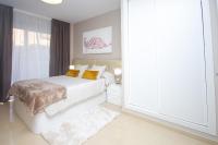 Posteľ alebo postele v izbe v ubytovaní Holiday Deluxe Apartment Miramar Magic World