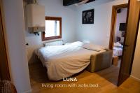 A bed or beds in a room at Sole & Luna apartments