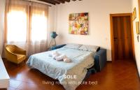 A bed or beds in a room at Sole & Luna apartments