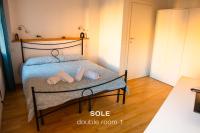A bed or beds in a room at Sole & Luna apartments
