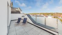 Balkón alebo terasa v ubytovaní Apartamenty Sun & Snow Baltic Sun z basenem i placem zabaw