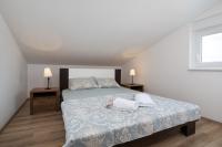 Postel nebo postele na pokoji v ubytování Apartments Jakoplić