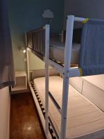 a bunk bed with a ladder on top of it at Superbe studio 4&#47;5 pers dans résidence cap esterel in Agay - Saint Raphael