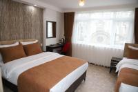 Cama o camas de una habitaci&oacute;n en HOTEL GLOBAL 2022