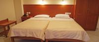A bed or beds in a room at Neon Studios