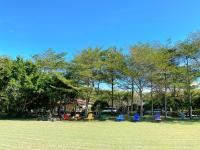 a group of chairs sitting in a park at Kenting Tuscany Resort in Kenting