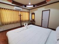 Postel nebo postele na pokoji v ubytování Sand-D House Pool Villa A3 at Rock Garden Beach Resort Rayong