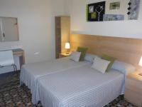 Postel nebo postele na pokoji v ubytování Hostal Eixample