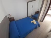 Postel nebo postele na pokoji v ubytování TENERIFE LITTLE VILLAGE 1D