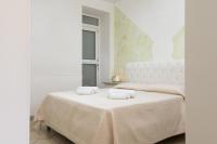 Posteľ alebo postele v izbe v ubytovaní Appartamento Gardenia in Villa Mariella