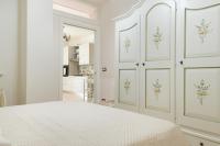 Posteľ alebo postele v izbe v ubytovaní Appartamento Gardenia in Villa Mariella