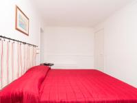 A bed or beds in a room at Apartment Girasole by Interhome