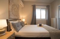 Posteľ alebo postele v izbe v ubytovaní Athens Terrace 360°