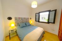 Postel nebo postele na pokoji v ubytování Patio Rialto Apartment