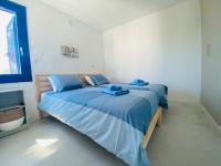 A bed or beds in a room at Apartamento Brumar2 Corralejo
