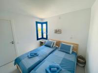 A bed or beds in a room at Apartamento Brumar2 Corralejo