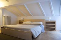A bed or beds in a room at Via de' Falegnami 6 Apartment by Wonderful Italy