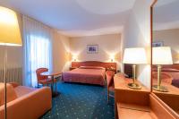 Posteľ alebo postele v izbe v ubytovaní Hotel La Perla