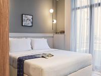 Posteľ alebo postele v izbe v ubytovaní Athens City View Urban Suites