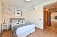 A bed or beds in a room at Par 4 Blue Star by VillaGranCanaria