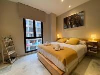A bed or beds in a room at Premium Center Alameda