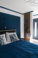 A bed or beds in a room at KRACHER Landhaus No 3 - inklusive Pool