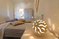 A bed or beds in a room at Casa Vacanza Black Magic Otranto