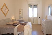A bed or beds in a room at Casa Vacanza Black Magic Otranto