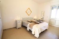A bed or beds in a room at Casa Vacanza Black Magic Otranto