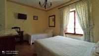 Postel nebo postele na pokoji v ubytování Hotel Rural Ovio