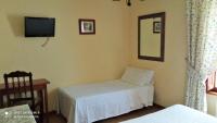 Postel nebo postele na pokoji v ubytování Hotel Rural Ovio