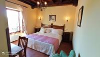 Postel nebo postele na pokoji v ubytování Hotel Rural Ovio