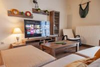 Televízia a/alebo spoločenská miestnosť v ubytovaní Village Loft House