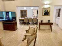 A television and/or entertainment centre at Villa Podere Del Grasso