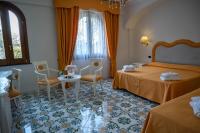 A bed or beds in a room at Villa Le Zagare Relais & SPA
