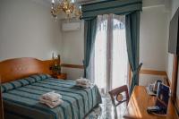 A bed or beds in a room at Villa Le Zagare Relais & SPA