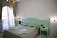A bed or beds in a room at Villa Le Zagare Relais & SPA
