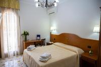 A bed or beds in a room at Villa Le Zagare Relais & SPA