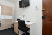 Televízia a/alebo spoločenská miestnosť v ubytovaní Rooms Bale 2150