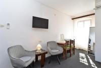 Televízia a/alebo spoločenská miestnosť v ubytovaní Rooms Bale 2150