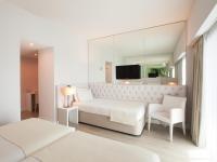 a white bedroom with a bed and a mirror at Lutecia Smart Design Hotel in Lisbon