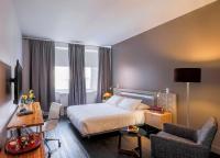 a hotel room with a bed and a desk and chair at NU Hotel in Brooklyn