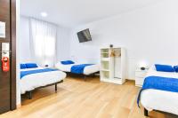 Posteľ alebo postele v izbe v ubytovaní Laramond Barcelona Rooms