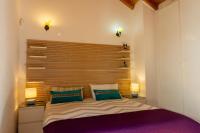 A bed or beds in a room at Idyllic Townhouse in Marbella Old Town