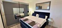 Posteľ alebo postele v izbe v ubytovaní Apartments CVITA Holiday
