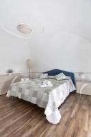 A bed or beds in a room at Casa la Perla