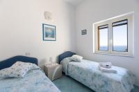 A bed or beds in a room at Casa la Perla