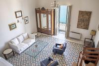 A seating area at Duplex sul porto grande by Wonderful Italy