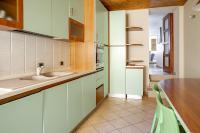 A kitchen or kitchenette at Duplex sul porto grande by Wonderful Italy